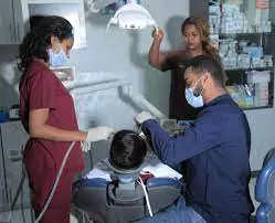 Dental doctors in Dr. Emebet Dental clinic giving service to a paatient.