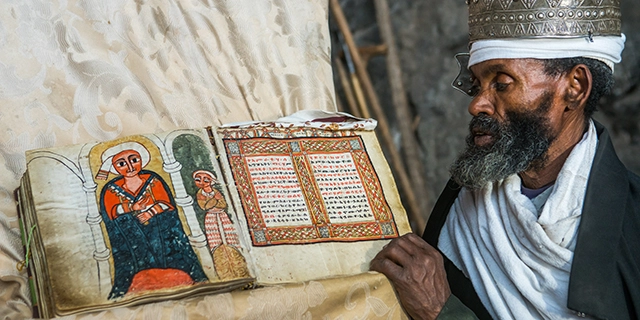 Ethiopian Orthodox Tewahedo Church holding a spritual book