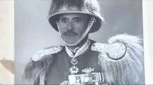 Abdissa Aga wearing military outfit